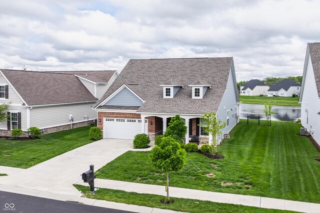 14878 Anees Ln, Fishers, IN 46040 - view of front facade featuring roof with shingles, a front lawn, driveway, and brick siding
