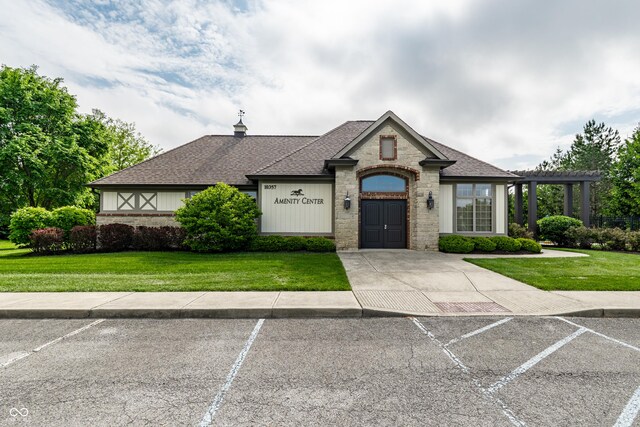 14878 Anees Ln, Fishers, IN 46040 - view of front of house featuring roof with shingles, uncovered parking, and a front lawn