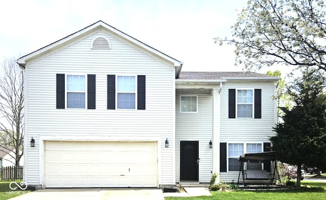 6634 Frankenberger Dr, Indianapolis, IN 46237 - view of front facade with concrete driveway and an attached garage