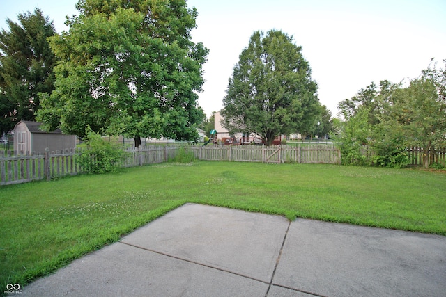 6634 Frankenberger Dr, Indianapolis, IN 46237 - fenced backyard with a patio and a storage unit