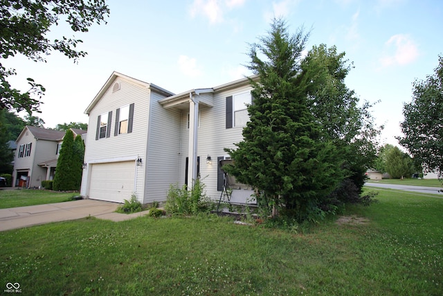 6634 Frankenberger Dr, Indianapolis, IN 46237 - view of home's exterior featuring an attached garage, a lawn, and concrete driveway