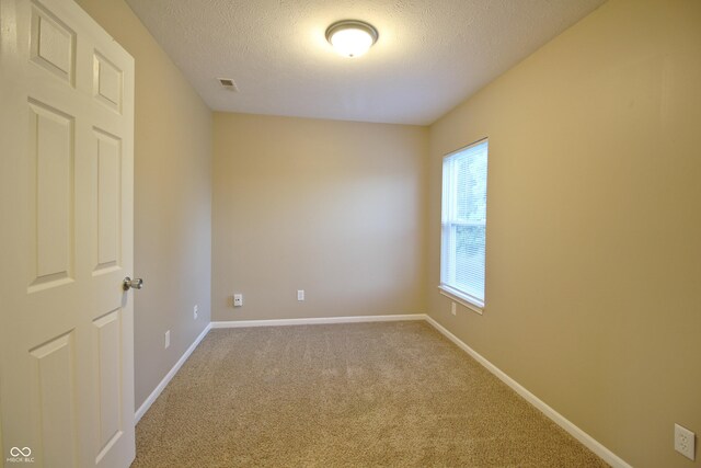 6634 Frankenberger Dr, Indianapolis, IN 46237 - unfurnished room featuring a textured ceiling and carpet flooring