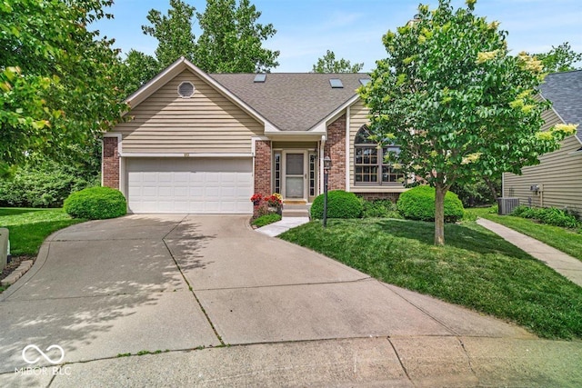 65 Palomino Ct, Zionsville, IN 46077 - view of front of property with brick siding, concrete driveway, a front yard, a garage, and a shingled roof