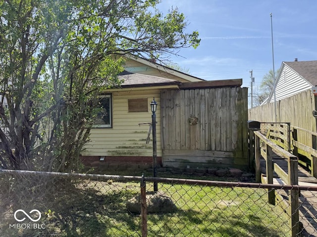 view of side of property featuring fence