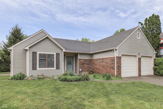 ranch-style house featuring roof with shingles, a front yard, brick siding, aphalt driveway, and an attached garage
