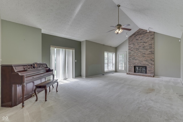 living room with carpet flooring, a ceiling fan, a textured ceiling, and high vaulted ceiling