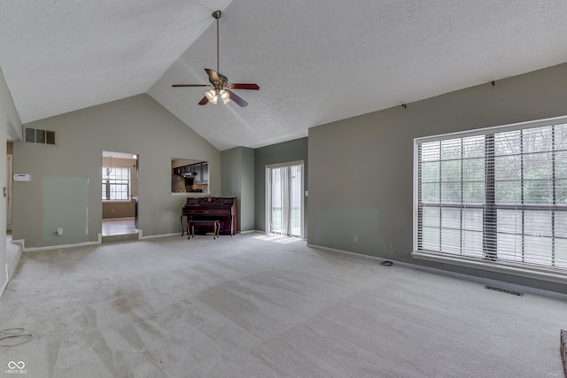 unfurnished living room with carpet flooring, a ceiling fan, baseboards, and visible vents