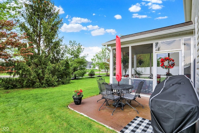 view of yard featuring a patio area and a sunroom