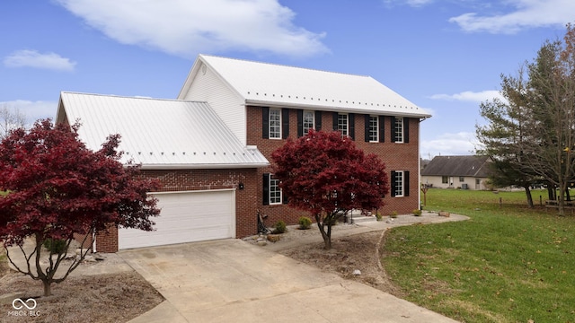 view of front of property with driveway, brick siding, and a front lawn