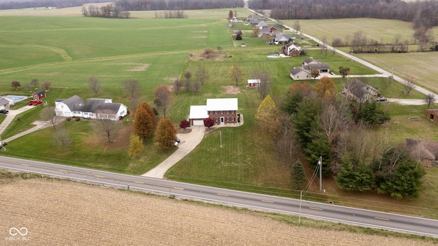 birds eye view of property with a rural view