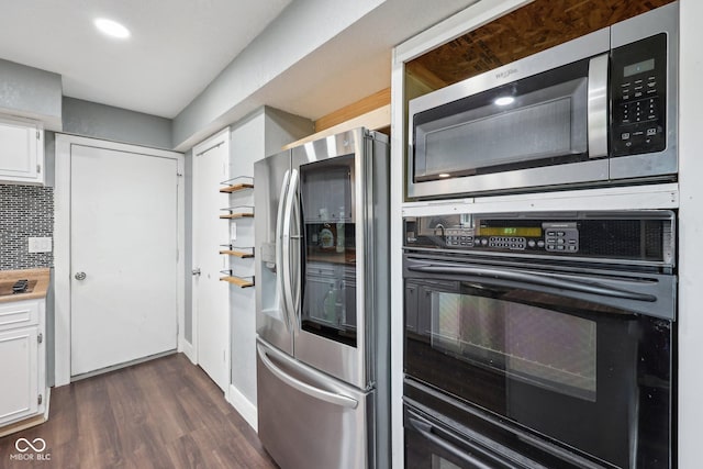 1416 Wellington Ave, Indianapolis, IN 46219 - kitchen with light countertops, stainless steel appliances, white cabinetry, decorative backsplash, and dark wood-type flooring