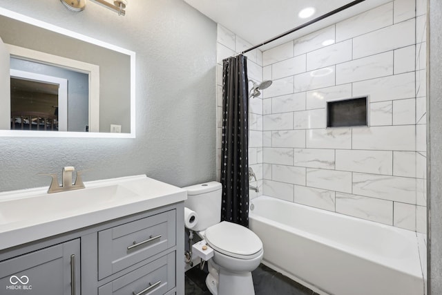 1416 Wellington Ave, Indianapolis, IN 46219 - bathroom featuring vanity, a textured wall, shower / bath combo, and toilet