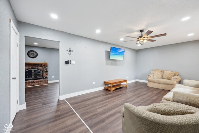1416 Wellington Ave, Indianapolis, IN 46219 - living room featuring recessed lighting, dark wood-type flooring, a brick fireplace, and ceiling fan