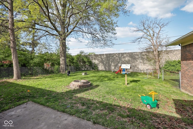 1416 Wellington Ave, Indianapolis, IN 46219 - view of yard featuring fence and an outdoor fire pit