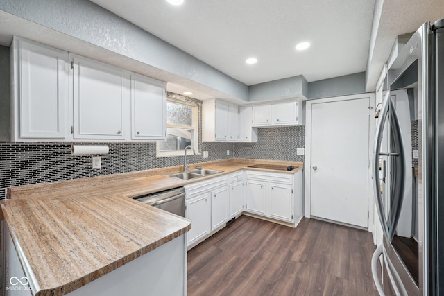 1416 Wellington Ave, Indianapolis, IN 46219 - kitchen with smart refrigerator, dark wood finished floors, a sink, light countertops, and a peninsula