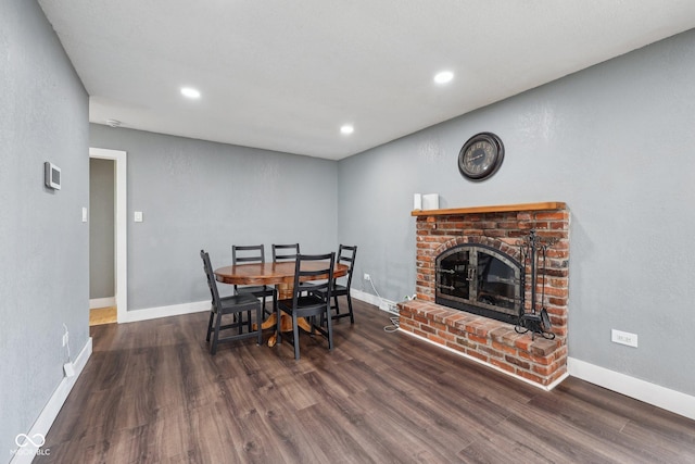 1416 Wellington Ave, Indianapolis, IN 46219 - dining space with a brick fireplace, recessed lighting, baseboards, and wood finished floors