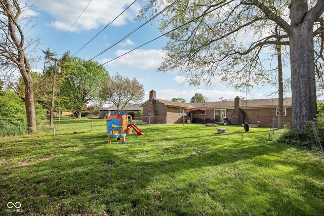 1416 Wellington Ave, Indianapolis, IN 46219 - view of yard featuring fence and a playground