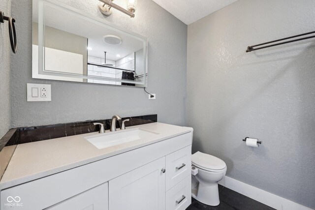 1416 Wellington Ave, Indianapolis, IN 46219 - full bathroom with toilet, a textured wall, walk in shower, and vanity