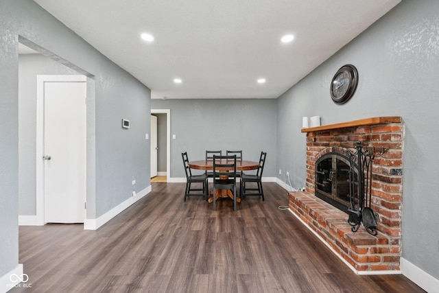 1416 Wellington Ave, Indianapolis, IN 46219 - dining area featuring recessed lighting, baseboards, wood finished floors, and a fireplace
