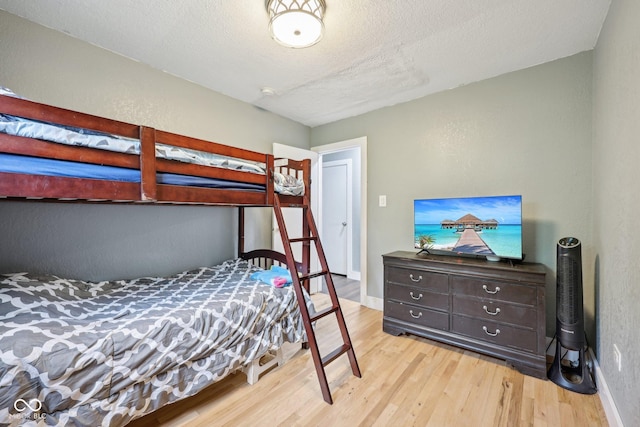 1416 Wellington Ave, Indianapolis, IN 46219 - bedroom with baseboards and wood finished floors