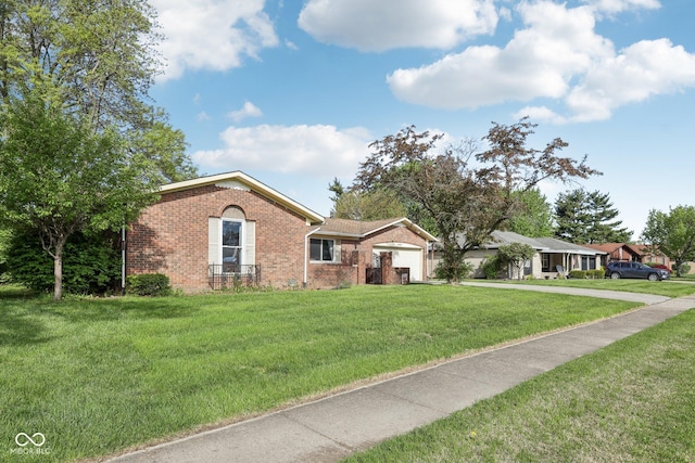 1416 Wellington Ave, Indianapolis, IN 46219 - ranch-style house with a garage, concrete driveway, a front yard, and brick siding