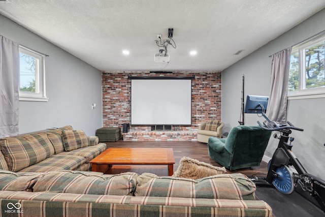 1416 Wellington Ave, Indianapolis, IN 46219 - living area with brick wall, recessed lighting, wood finished floors, and visible vents