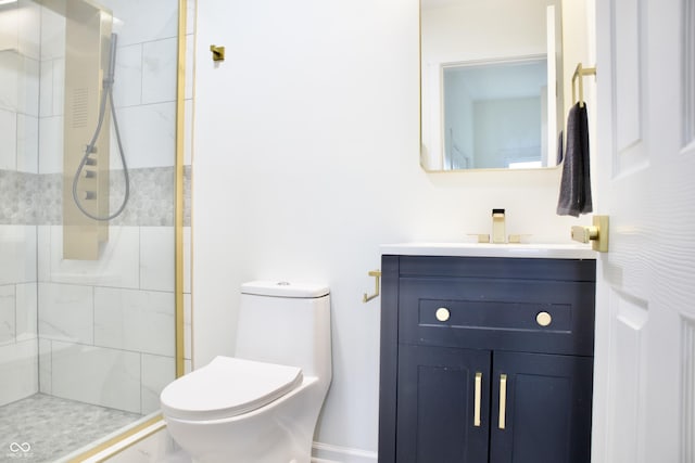 474 N Randolph St, Indianapolis, IN 46201 - bathroom featuring toilet, tiled shower, and vanity