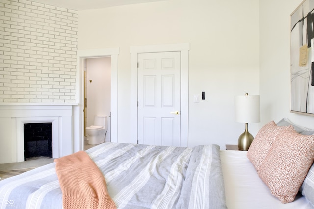 474 N Randolph St, Indianapolis, IN 46201 - bedroom featuring ensuite bathroom and a fireplace