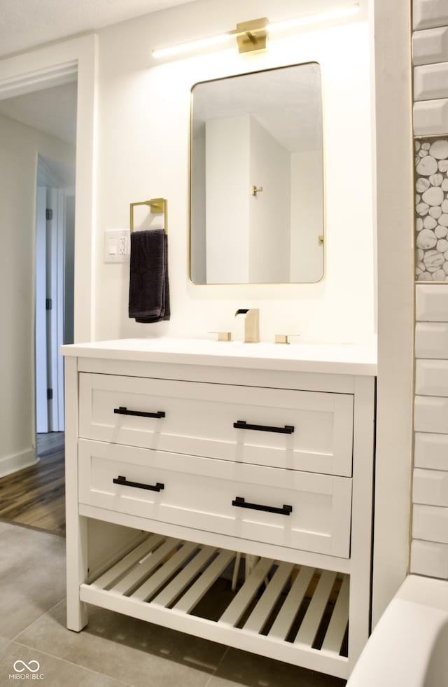 474 N Randolph St, Indianapolis, IN 46201 - bathroom featuring tile patterned flooring and vanity