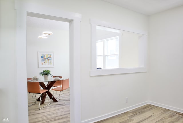 474 N Randolph St, Indianapolis, IN 46201 - corridor with baseboards, visible vents, and light wood-style floors