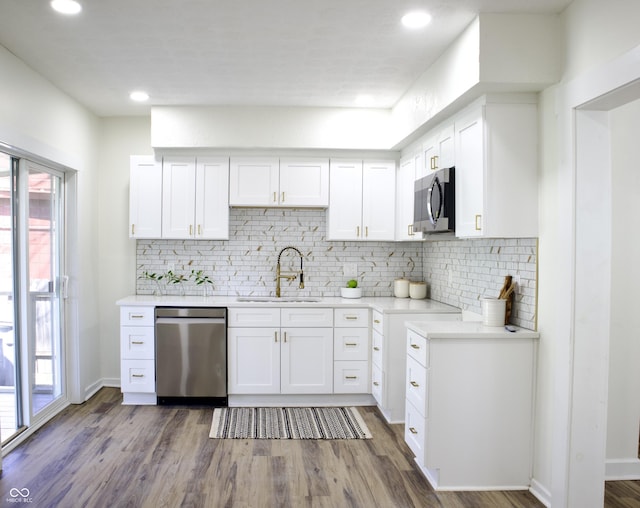 474 N Randolph St, Indianapolis, IN 46201 - kitchen featuring light countertops, stainless steel appliances, decorative backsplash, and a sink