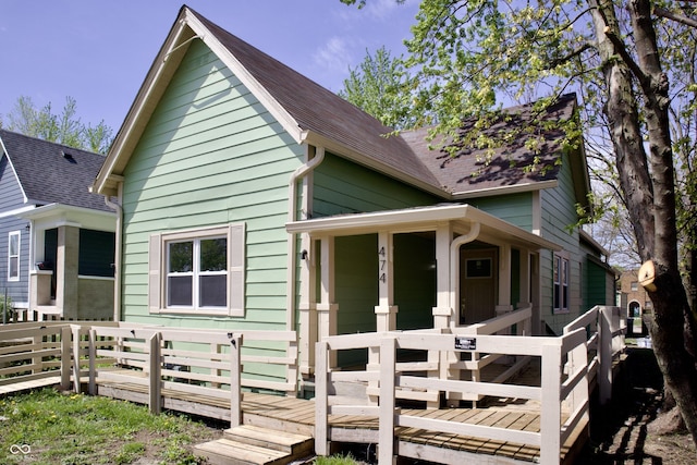 474 N Randolph St, Indianapolis, IN 46201 - exterior space with a wooden deck and a shingled roof