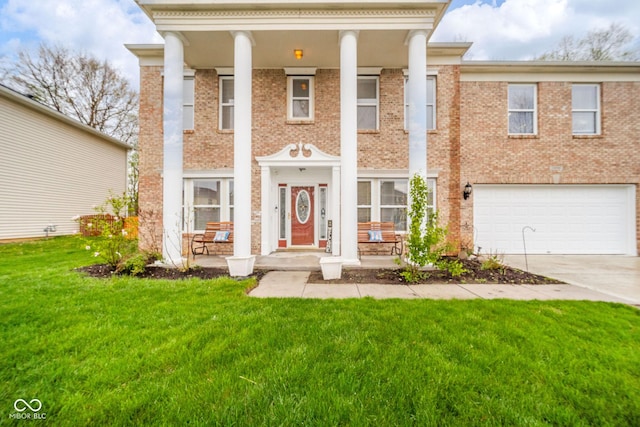 neoclassical / greek revival house with a porch, a front yard, brick siding, concrete driveway, and an attached garage