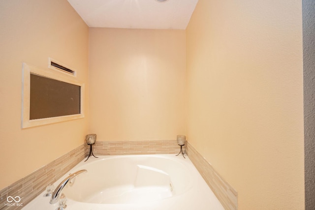 bathroom featuring a bath