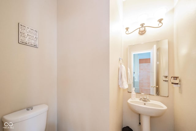 half bath featuring toilet