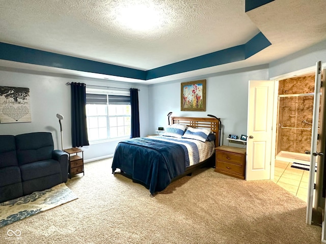 bedroom with carpet floors and a textured ceiling
