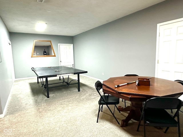 rec room with light carpet and baseboards
