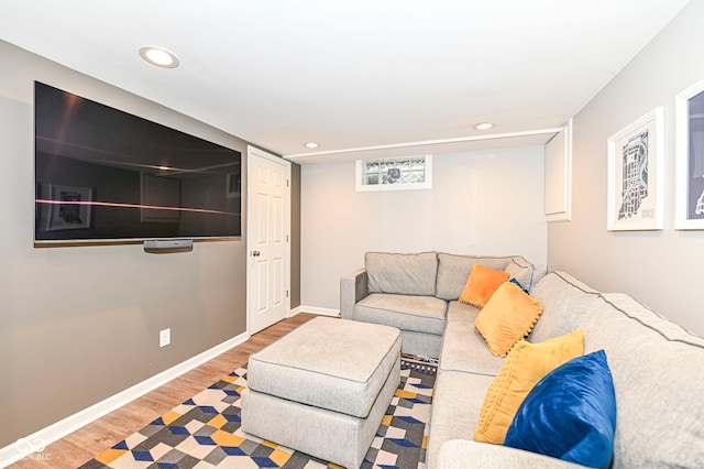 living area with baseboards, recessed lighting, and wood finished floors