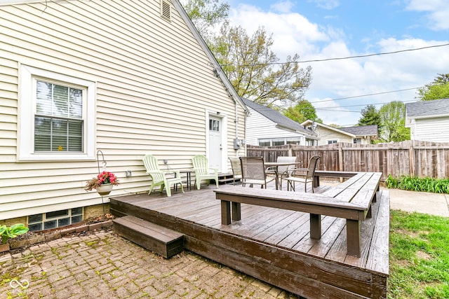 wooden deck featuring fence and outdoor dining area