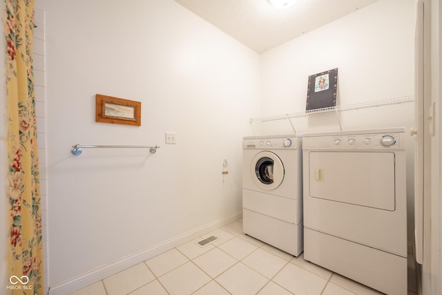 476 Glenview Dr, Greencastle, IN 46135 - washroom with washer and dryer and light tile patterned floors