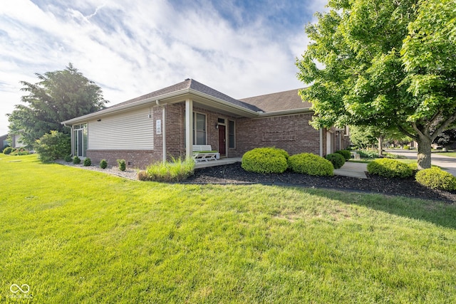476 Glenview Dr, Greencastle, IN 46135 - view of side of home with brick siding, a lawn, and covered porch