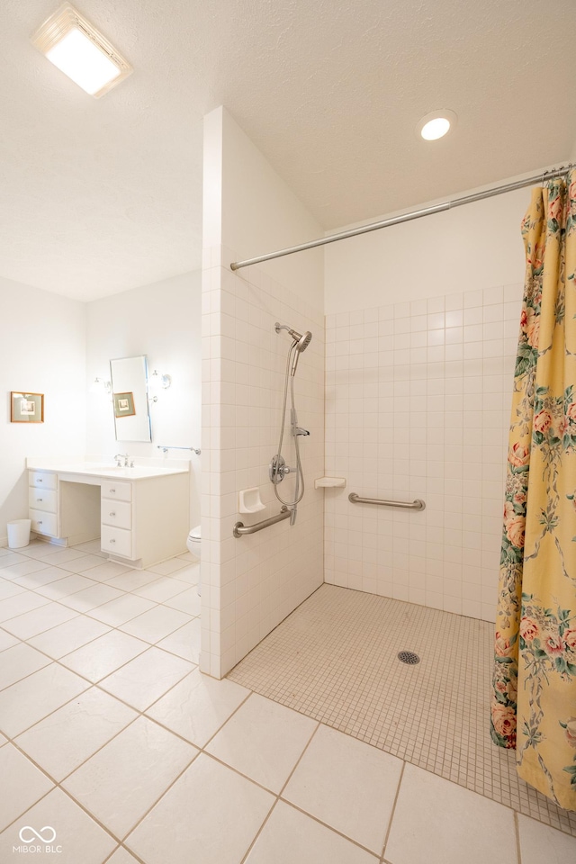 476 Glenview Dr, Greencastle, IN 46135 - bathroom with tiled shower, vanity, tile patterned floors, and recessed lighting
