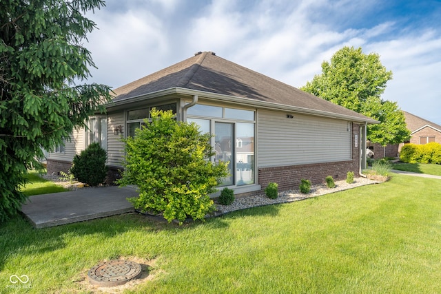 476 Glenview Dr, Greencastle, IN 46135 - view of home's exterior with a yard, brick siding, and a shingled roof