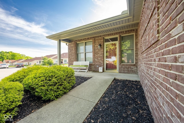 476 Glenview Dr, Greencastle, IN 46135 - doorway to property featuring covered porch and brick siding