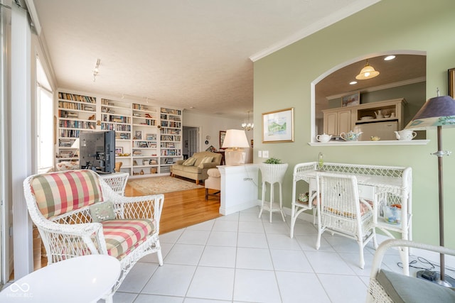 476 Glenview Dr, Greencastle, IN 46135 - living area with ornamental molding, tile patterned floors, and arched walkways