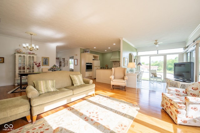 476 Glenview Dr, Greencastle, IN 46135 - living area with crown molding, light wood finished floors, a chandelier, and a ceiling fan