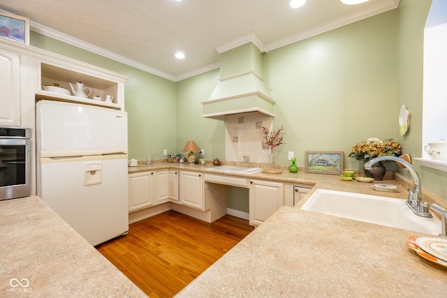 476 Glenview Dr, Greencastle, IN 46135 - kitchen with white appliances, open shelves, built in desk, light wood-style floors, and recessed lighting