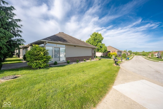 476 Glenview Dr, Greencastle, IN 46135 - view of side of home with brick siding and a yard