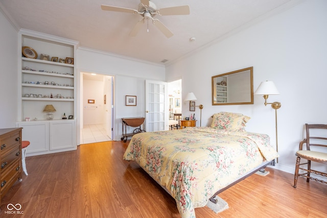 476 Glenview Dr, Greencastle, IN 46135 - bedroom featuring wood finished floors, ornamental molding, connected bathroom, and a ceiling fan