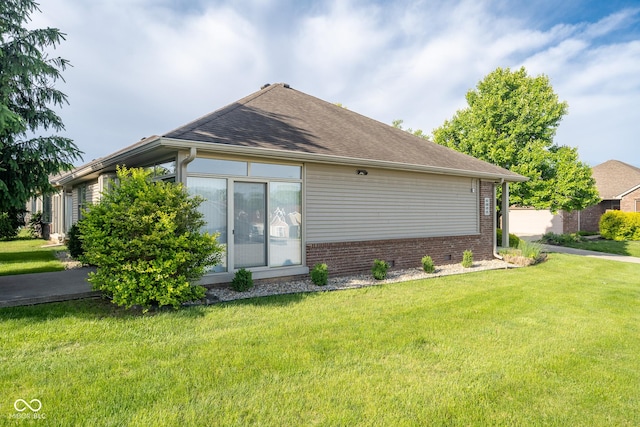 476 Glenview Dr, Greencastle, IN 46135 - view of home's exterior featuring a lawn, brick siding, and a shingled roof